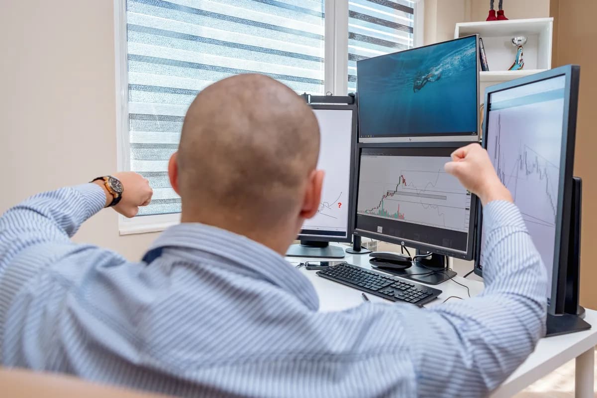 professional trader preparing for a prop firm challenge at a multi-monitor workstation